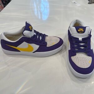 Never been worn. Purple and Gold Nikes